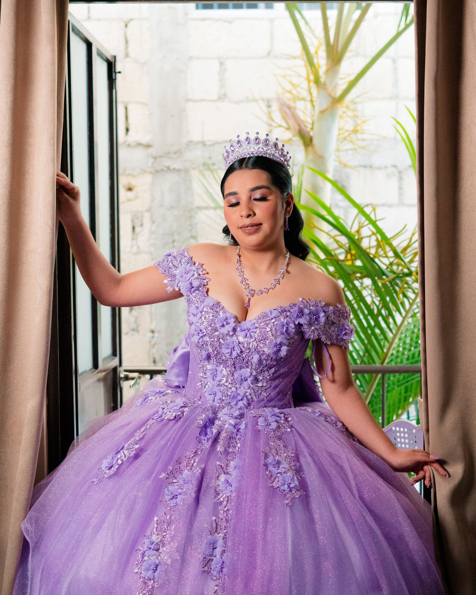 A lavender Sweet 16 ball gown with a beaded bodice and tiara